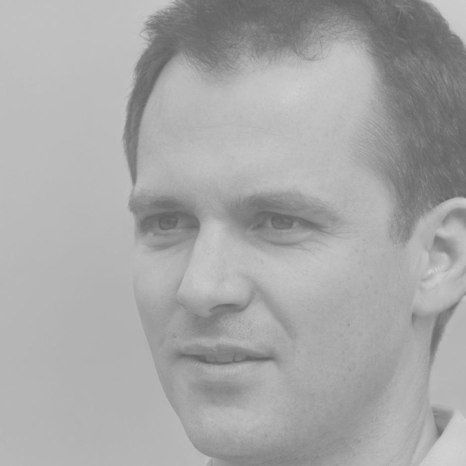 Professional headshot of economic researcher